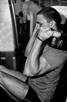 Man doing athlete exercise in fitness club