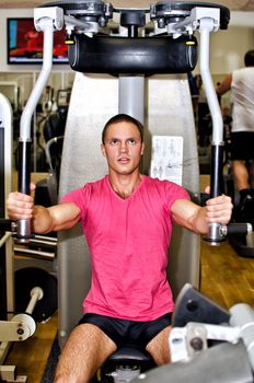 Man doing athlete exercise in fitness club