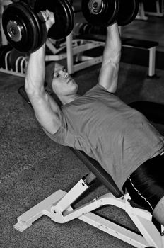 Man doing athlete exercise in fitness club