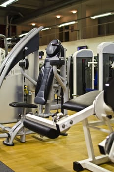 Athletic gym machine in fitness club