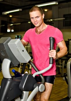 Man doing athlete exercise in fitness club