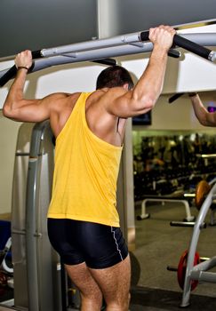 Man doing athlete exercise in fitness club