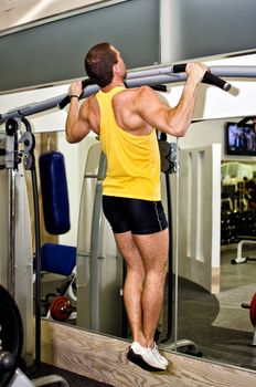 Man doing athlete exercise in fitness club