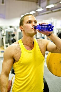 Man doing athlete exercise in fitness club