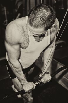 Man doing athlete exercise in fitness club