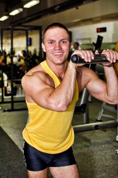 Portrait of handsome bodybuilder in fitness club