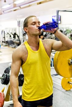 Man doing athlete exercise in fitness club