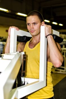 Man doing athlete exercise in fitness club