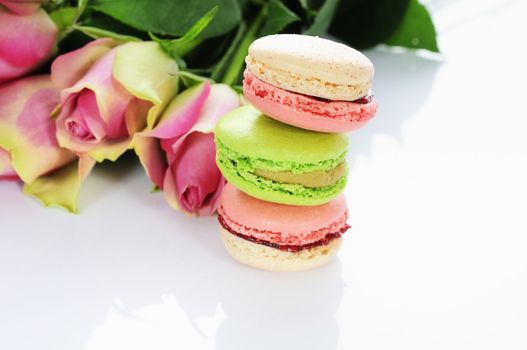 beautiful rose and assortment of macarons