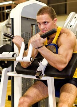 Man doing athlete exercise in fitness club