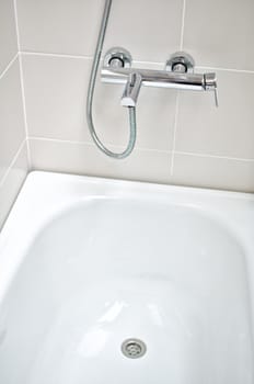 Interior of bathroom with faucet and bathtub