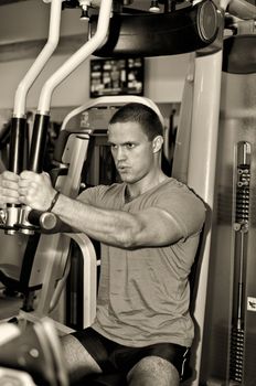 Man doing athlete exercise in fitness club