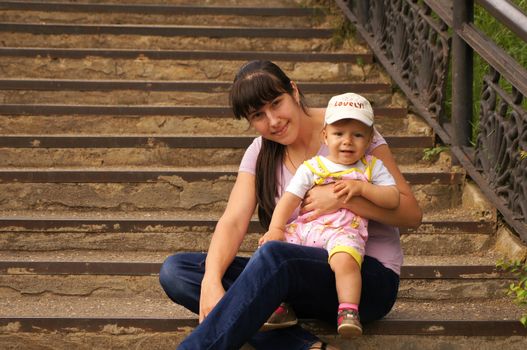 The little boy with mum on walk