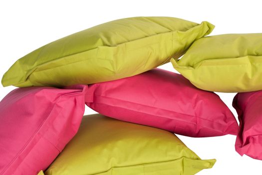 bright stack of pink and green pillows isolated on white