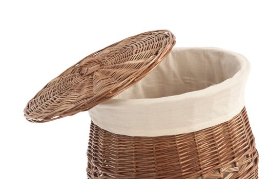 Isolated on white laundry basket made of rattan