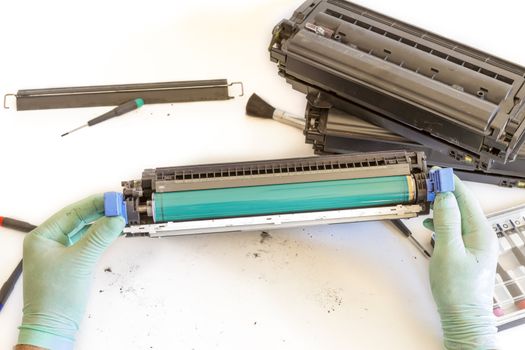 worker Laser printer on a workbench. Printer workshop