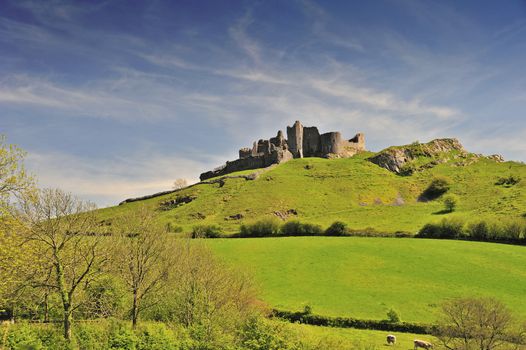 The ruins of Carreg Cennen Castle in Carmarthenshire, UK. Space for text in the sky