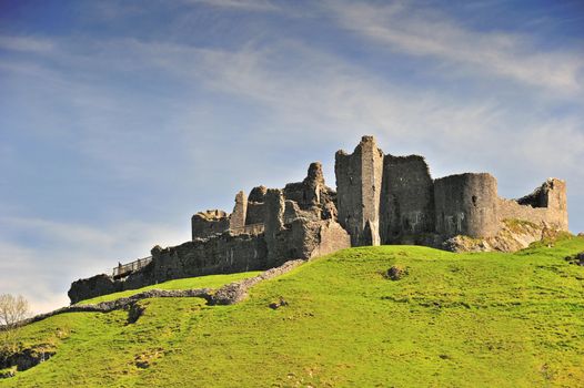 The ruins of Carreg Cennen Castle in Carmarthenshire, UK. Space for text in the sky