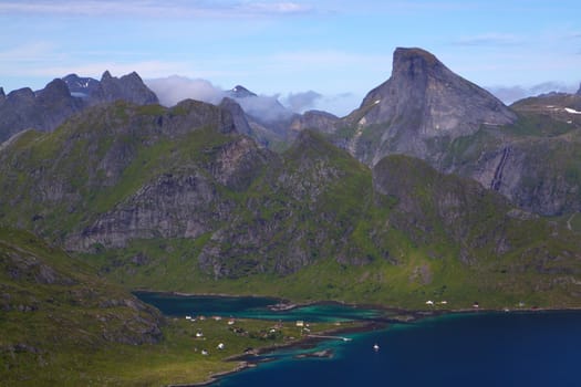 Picturesque mountain peaks towering above fjord on Lofoten islands in Norway