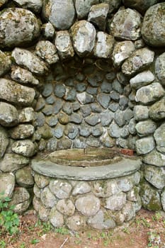 A Old stone well with structure