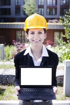 Female construction engineer show something on laptop
