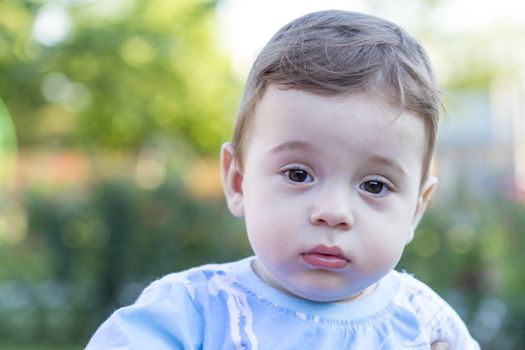 Portrait of a cute little baby boy with innocent eyes. 