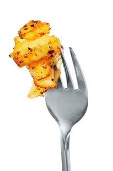 Fried potatoes  on  a fork.  Isolated  on white.