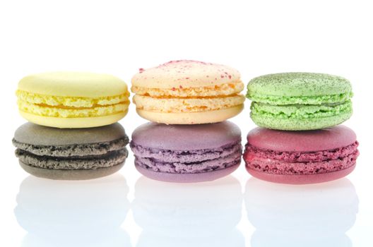 Colorful macaroon stack  on white  with reflection