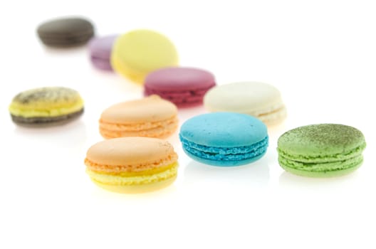 close up colorful  french macaroons on white background