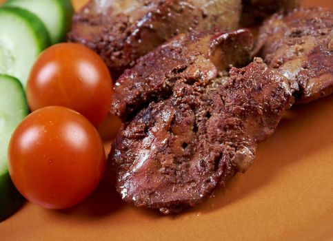 Chicken livers and vegetable.closeup