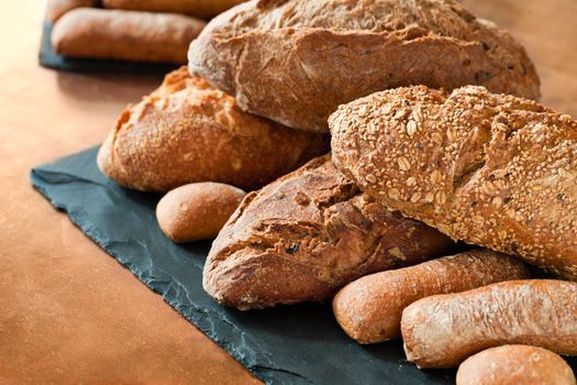 Close up of traditional whole wheat, cereal and brown bread.