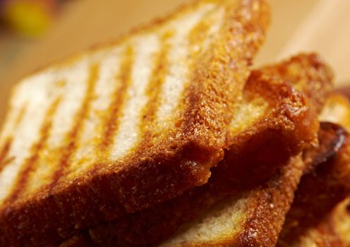 pile  toasted bread slices for breakfast.Close up of toasted white bread in slices
