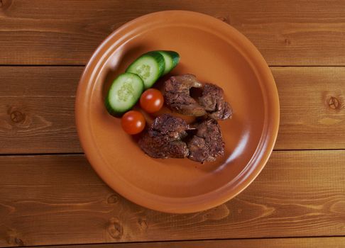 Chicken livers and vegetable.closeup
