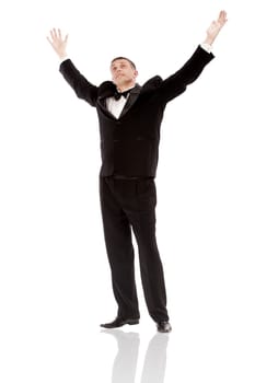 The elegant man in a classical tuxedo on a white background