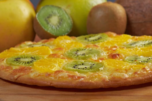 homemade sweet pizza with fruit.with orang kiwi,sauce