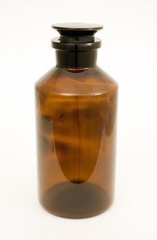  Bottle with a tight stopper of dark glass