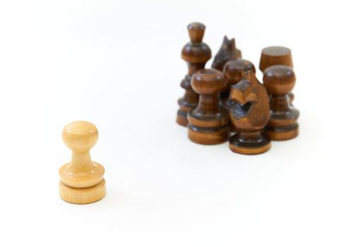 Chess pieces (pawn, knight, king) on white background