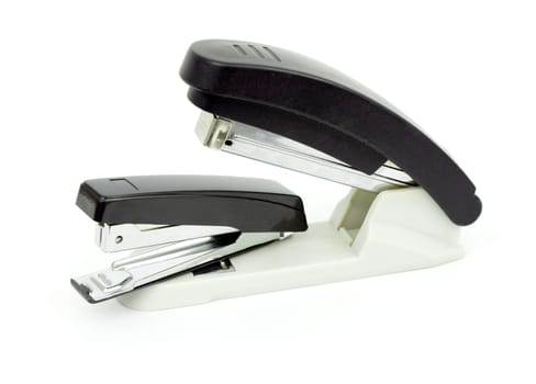 Two staplers. The concept of aggression