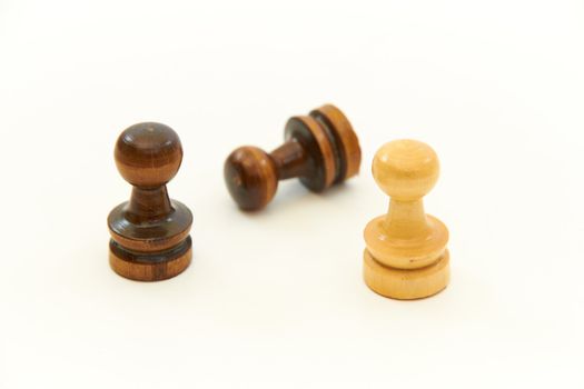 Brown and yellow chess pieces, pawns  on white background