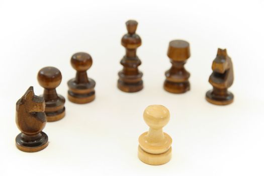 Chess pieces (pawn, knight, king) on white background