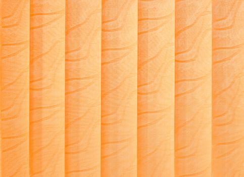 Orange vertical jalousie made of cloth. Background