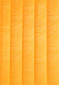 Orange vertical jalousie made of cloth. Background