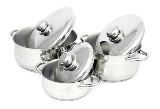 Pans made of stainless steel on a white background