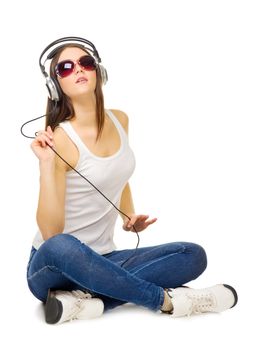 Young girl listen music by headphones isolated