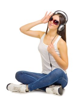 Young girl listen music by headphones isolated