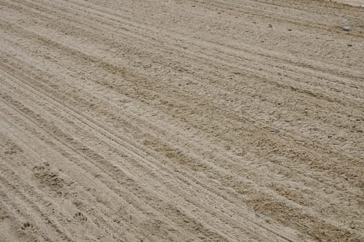 Sand texture with diagonal and parallel traces