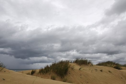 Very saddly day on a beach with many clouds