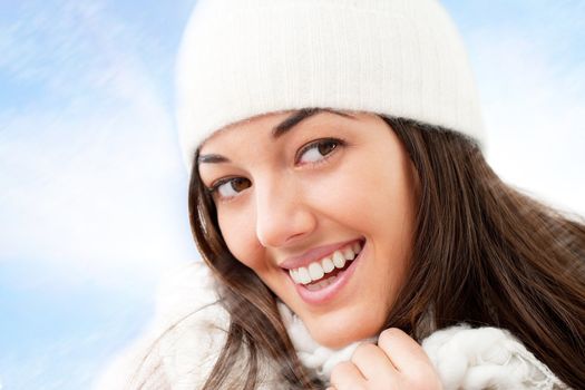 Close up of winter girl with attractive smile.