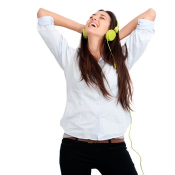 Young woman feeling happy listening music with headphones.Isolated.
