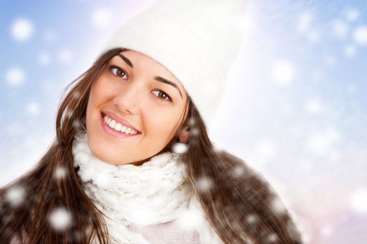 Postrait of Young attractive winter girl with scarf and snowflakes.